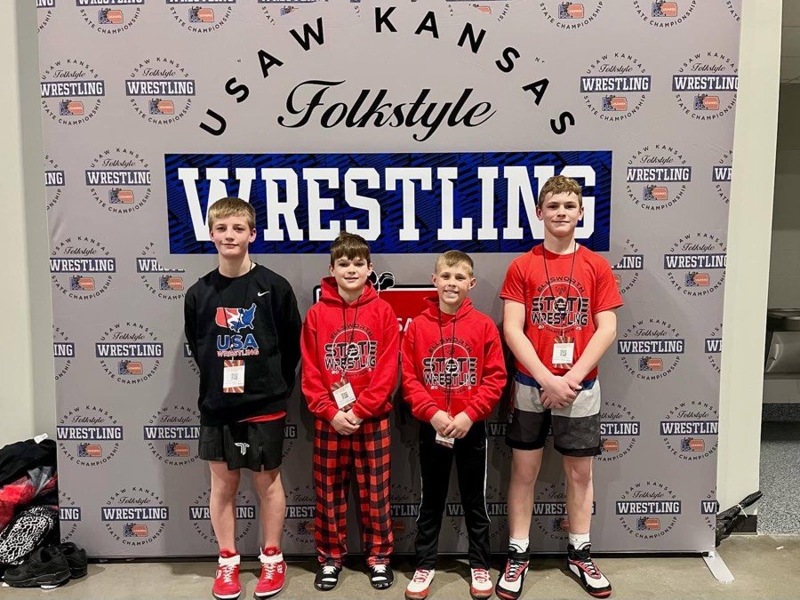Four Ellsworth wrestlers posing together at the state championships